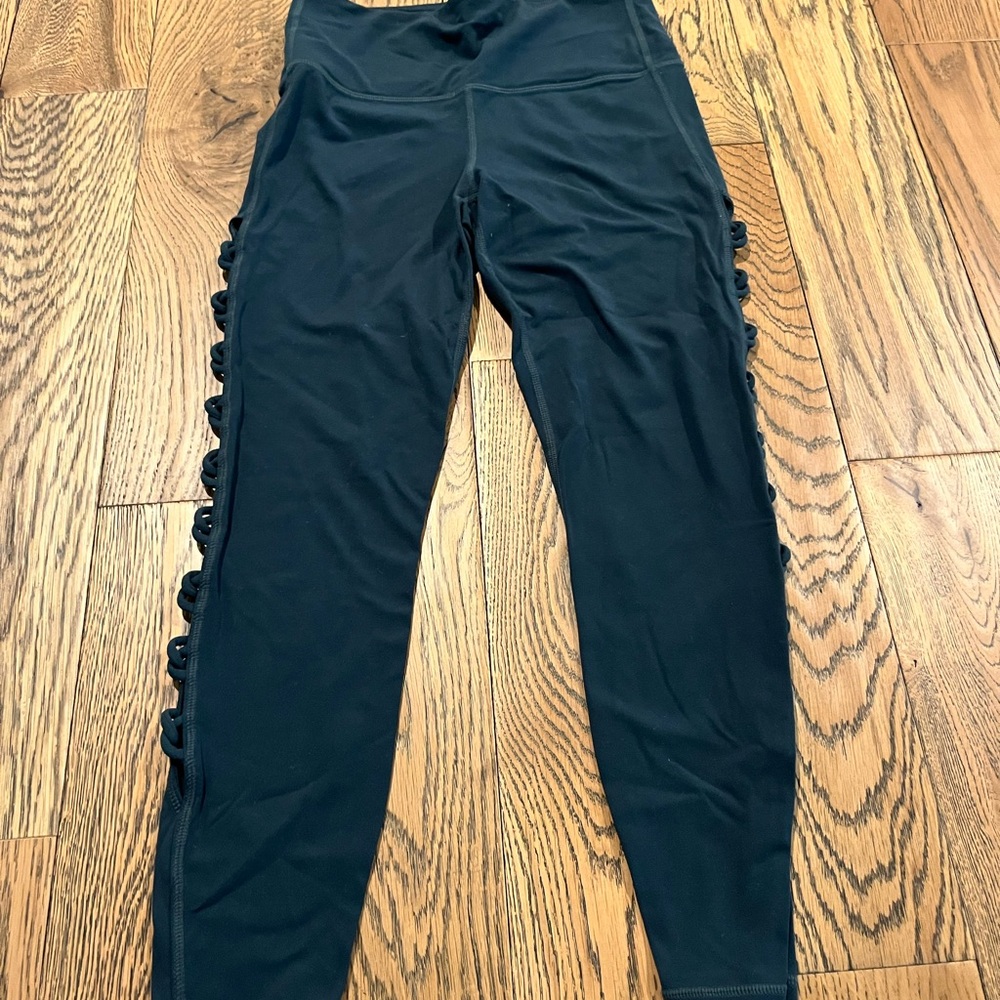 Athleta Black and Green Leggings with Stylish Cutouts